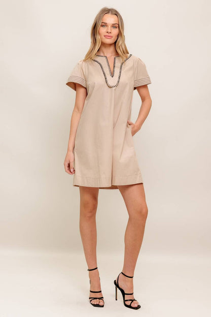 A solid woven mini dress