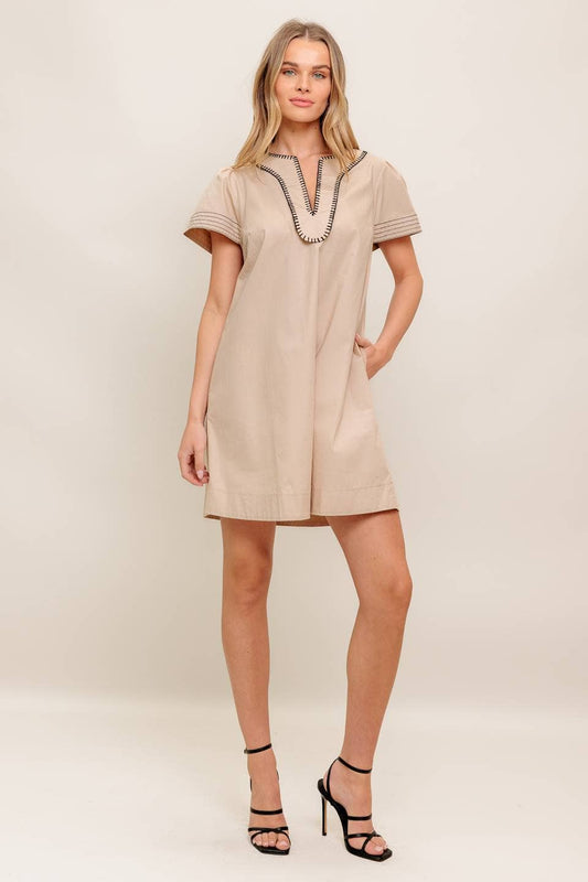A solid woven mini dress