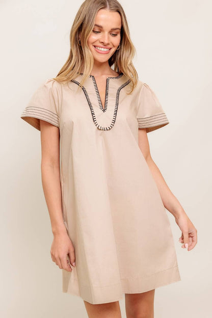 A solid woven mini dress
