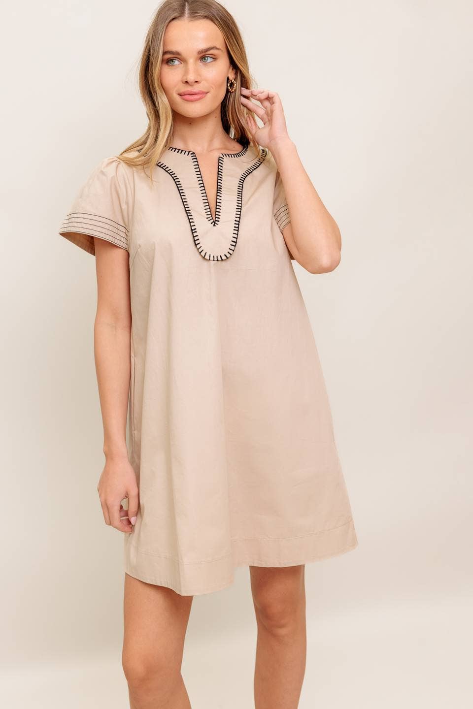 A solid woven mini dress