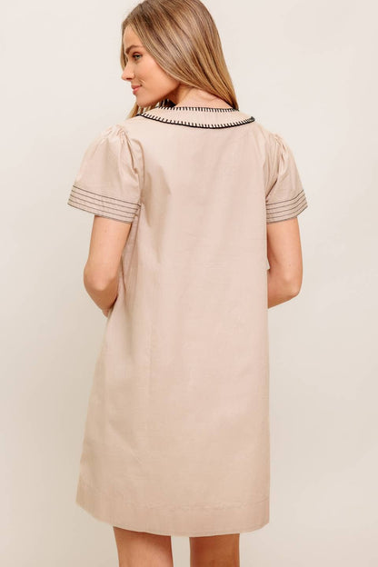 A solid woven mini dress